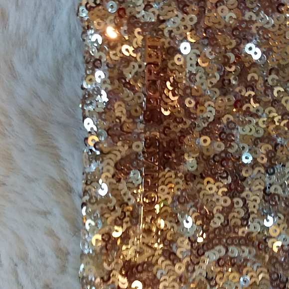 Gold Victoria's secret bag filled with a variety of beauty products. - Picture 2 of 13